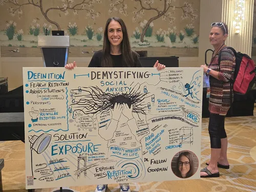 Event speaker holding a panel created by graphic recorder Matt Orley during her session at a DC area conference.