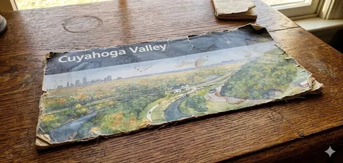 A rumpled map of the Cuyahoga Valley National Park sitting on a desk.