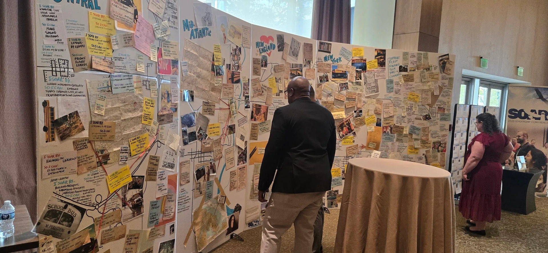 Conference Attendees reviewing a giant investigation board at an event.  20' wide, this massive installation includes photos, attendee statements, maps, ephemera and hand drawn elements.